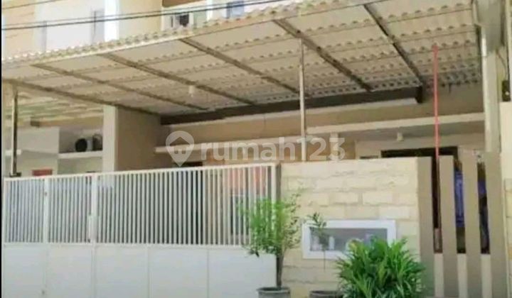 Affordable Minimalist 2-Story Manyar House in a Strategic Location Affordable Minimalist 2-Story Manyar House in a Strategic Location