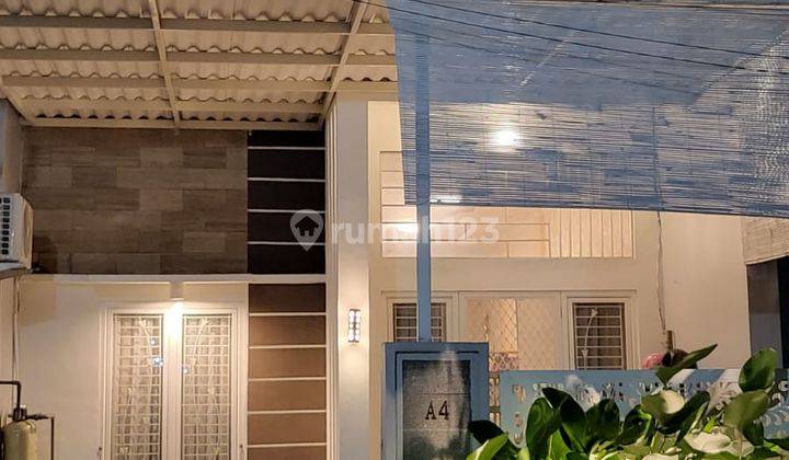 Rumah 2 Lantai Bagus Furnished SHM di Palem Putri Indah, Sidoarjo 1