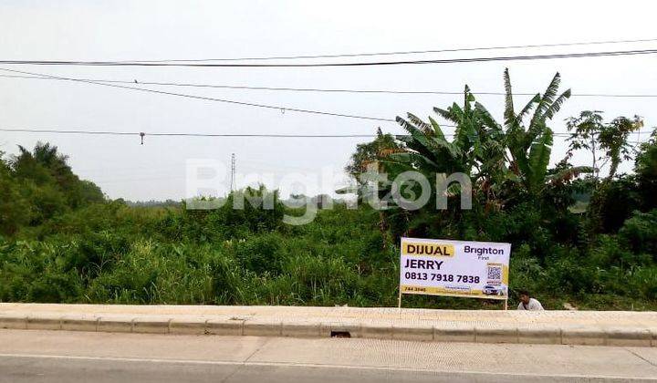 TANAH LUAS DI PINGGIR JALAN LOKASI STRATEGIS DI KARYA JAYA 1