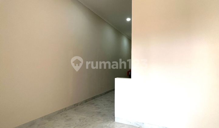 For quick sale, a 2-story house ready for renovation in Poris Indah, Tangerang.