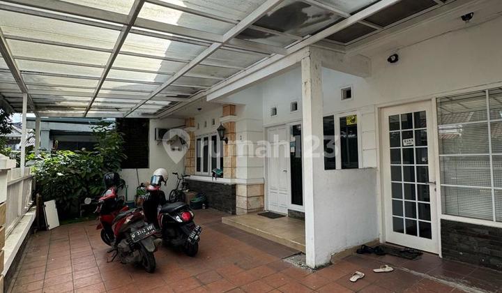 A well-maintained two-story house in the Batununggal housing complex, located on the flank of the Soekarno Hatta Bypass Road in Bandung.