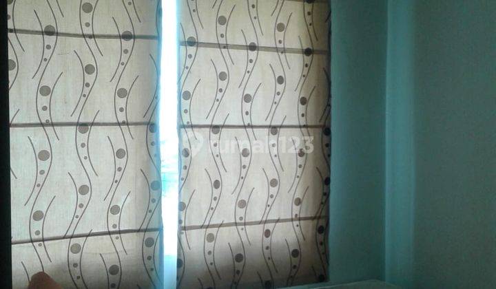 kamar tidur apartment cosmopolis yang asri di