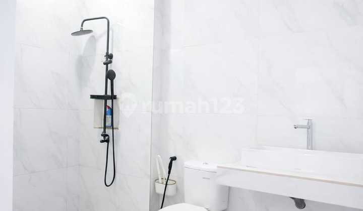 Minimalist House in Limo Cinere with Front and Back Gardens 2