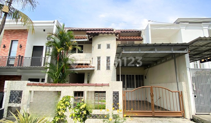 Minimalist House in Cinere Complex with 2-Story Backyard
