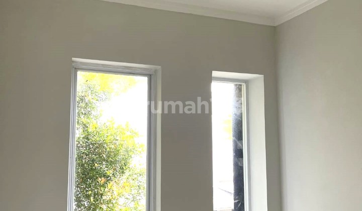Rumah Dalam Cluster di Graha Raya -9853Et 1