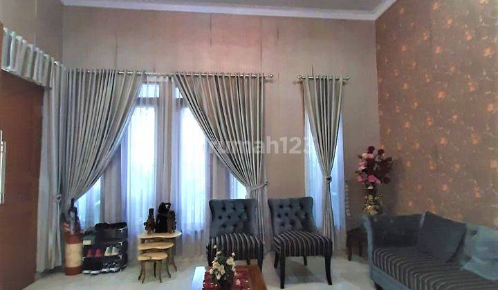 Rumah Siap Huni di Graha Raya Dengan Lay Out Dan Balkon Atas 1