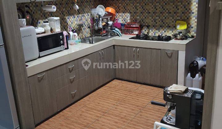 Rumah Asri Semi Furnished di Taman Kopo Indah 2