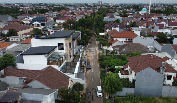 Land plot inside Duren Sawit complex with access for 2 cars.