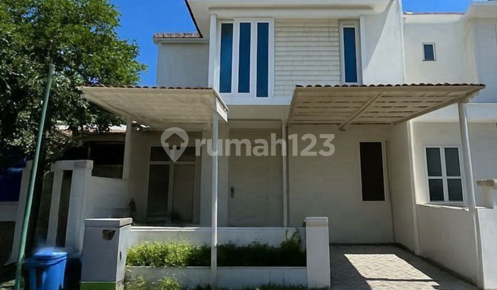 Rumah Taman Puspa Raya Citraland Utama Surabaya 