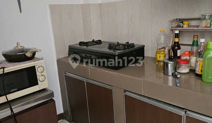 For Sale: 1.5-Story House with 102 M2 Land Area in Janur Kuning Complex 2