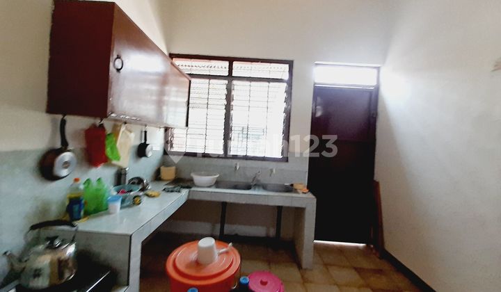 Large downtown house with a wide road that can fit two cars. 2