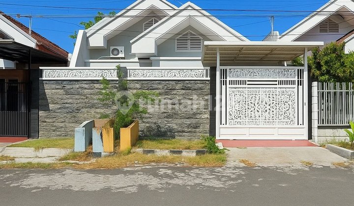 Rumah Dharmahusada Permai Strategis Siap Huni Carport 1