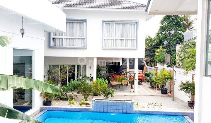 Rumah dengan kolam renang di Puri Hijau Townhouse Ciputat Timur 1