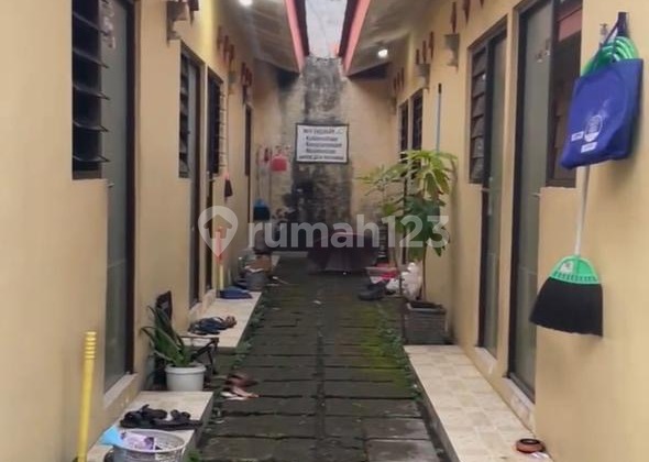 Land for Sale with House Building and Active Boarding House in East Lebak Asri