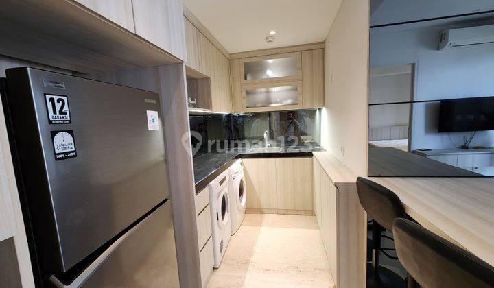 Apartemen Furnished View Garden 2BR Di Landmark Residence 1