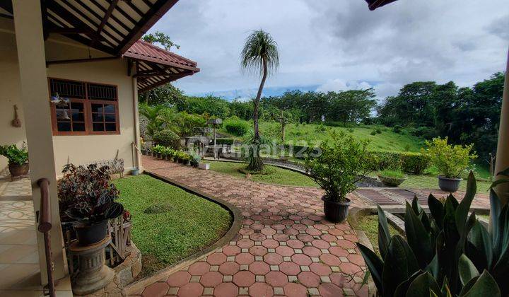 Tanah kebun 15 hektar plus rumah villa seluas 1000 m² view laut 25