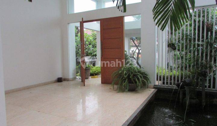 A 2 storey, 4 bedroom, stand alone house located in Cilandak, Jakarta with 4 bathrooms, a pool and a yard. 1