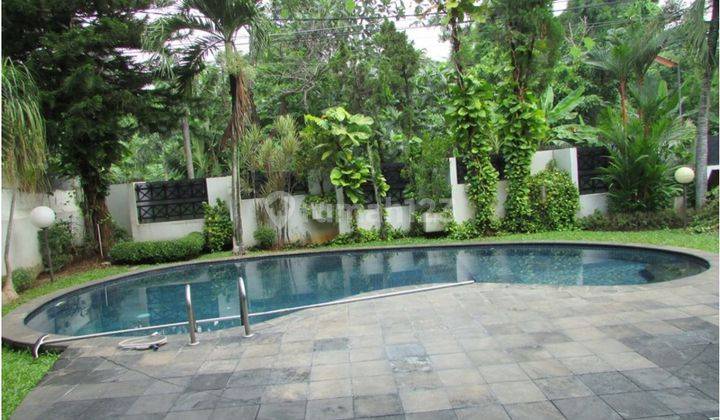 A 2 storey, 4 bedroom, compound house located in Cipete, Jakarta with 4 bathrooms, a pool and a yard. 1