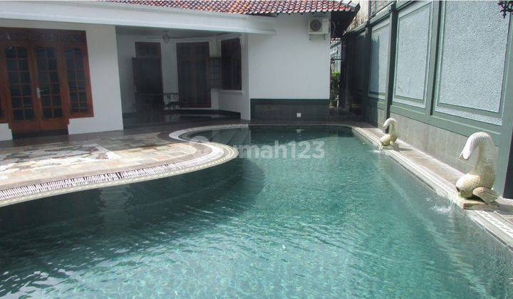 A 1 storey, 4 bedroom, stand alone house located in Cilandak, Jakarta with 4 bathrooms, a pool and a yard 1