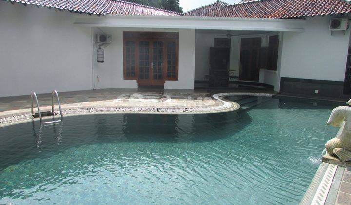 A 1 storey, 4 bedroom, stand alone house located in Cilandak, Jakarta with 4 bathrooms, a pool and a yard 2