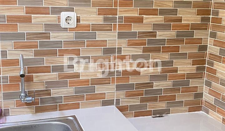  rumah baru belum pernah di tempati lokasi di belakang grand city Depok  2