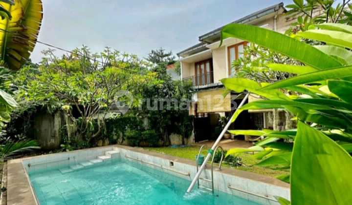 Two-story tropical house, lush and comfortable, with a swimming pool in Lebak Bulus, Cilandak, South Jakarta. 2