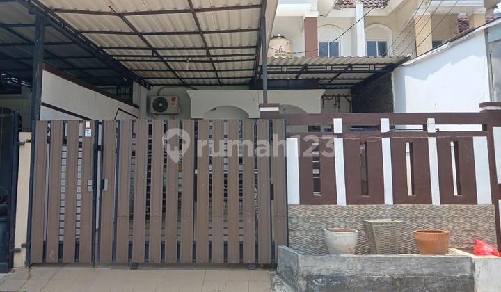 A 2-story ready-to-occupy house within a complex in Pamulang.