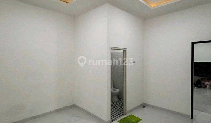 ruang keluarga rumah siap huni dalam perumahan