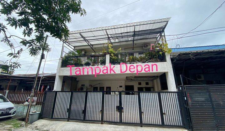 J1563-1v2= Rumah 2 lantai 126/239 m2 carport 3 mbl hadap selatan jelambar 1