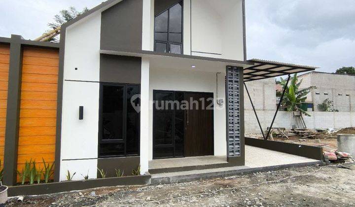 Rumah Modern Mezzanine di Pinggir Jalan Utama 1