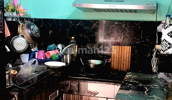 A single-story house in the Martubung area on Jalan Jala Asri.