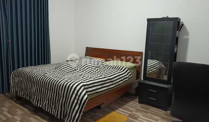 Comfortable Green Home for Sale with 2-Car Access in Setu Cipayung, East Jakarta 2