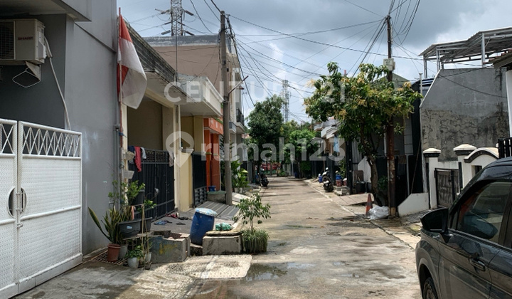 tampak depan rumah hitung tanah di perumahan