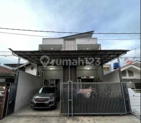 Di jual murah rumah baru renovasi di taman Surya, Ukuran 8x16 kt.4+1 km.4+1 Rumah di Jl. Taman Surya 2 Pegadungan, Kec.KaliDeres, Jakarta barat 2 Lantai SHM Sudah Renovasi Selatan 1