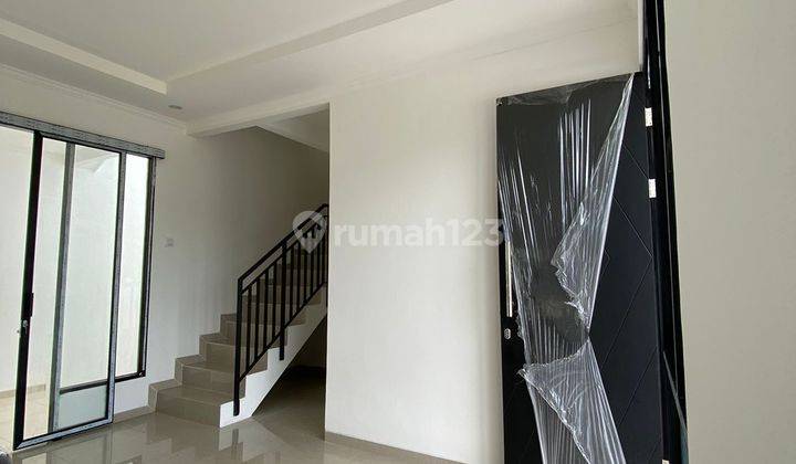 Rumah 2 Lantai Townhouse DP 45 juta-an Free Biaya Kanopi Dekat Tol  4