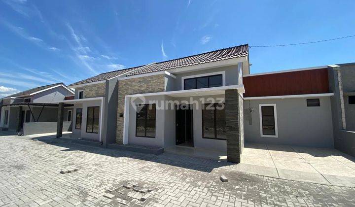 Rumah cluster Pesan Bangun pinggir jalan ramai 2