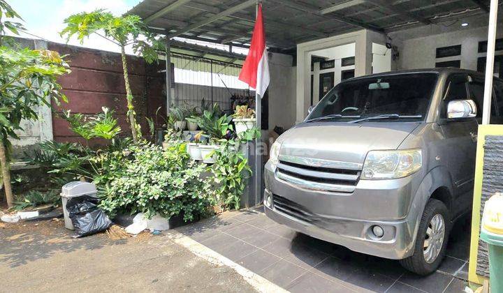 Rumah Dalam Cluster Di Lingkungan Asri Graha Raya 1