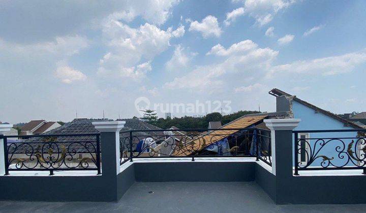 RUMAH SIAP HUNI HARGA DI BAWAH PASARAN ADA ROOFTOP DI TANAH BARU 2