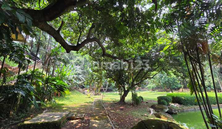 Land with Building for Sale, Spacious Yard in Tanjung Barat Area.
