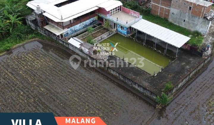 EN: "For Sale: Villa with Fishing Pond, a Hidden Gem in Karanglo, Malang."