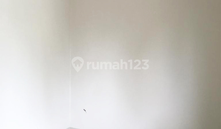 A 2-story house with 3 bedrooms, facing west, in front of a garden. 2