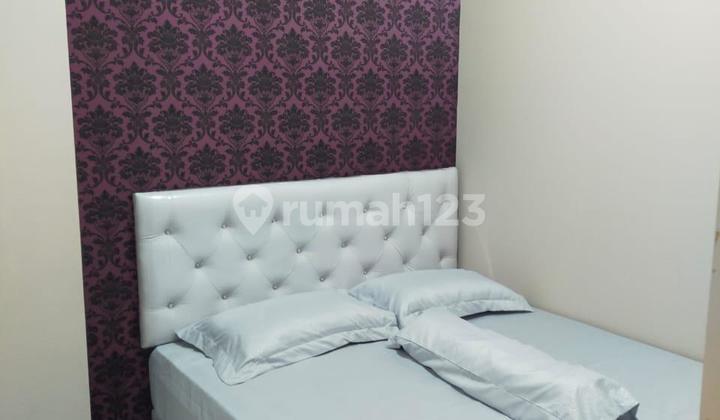 Sewa Apartemen Puncak Dharmahusada 2 Kamar Tidur Tower B Furnished 1