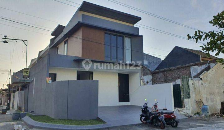 Rumah Babatan Pantai hook modern minimalis 2lantai 1