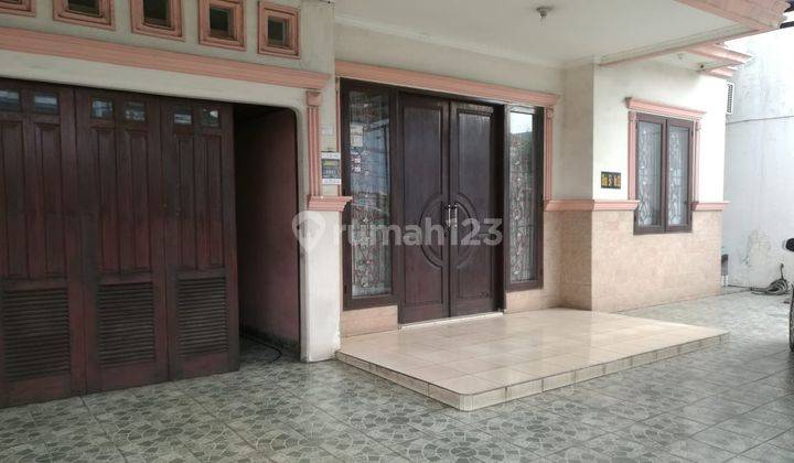 RUMAH  BESAR HADAP JALAN BESAR SHM DI TAMAN SURYA 2 JAKARTA BARAT 2