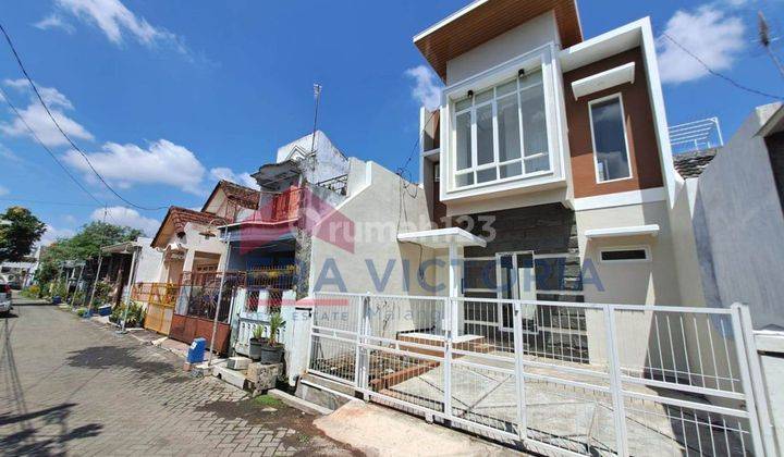 Rumah minimalis modern lokasi tengah kota, Sawojajar 1