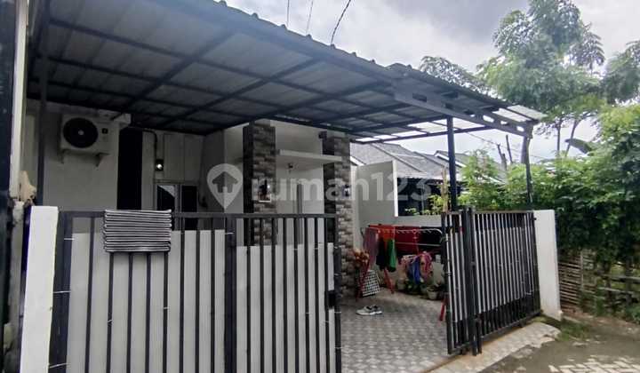 Rumah Minimalis dan Nempel Graha Raya Lokasi Strategis