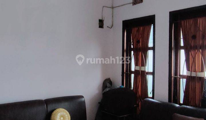 Rumah Di Tengah Kota Memiliki Ruang Usaha 2