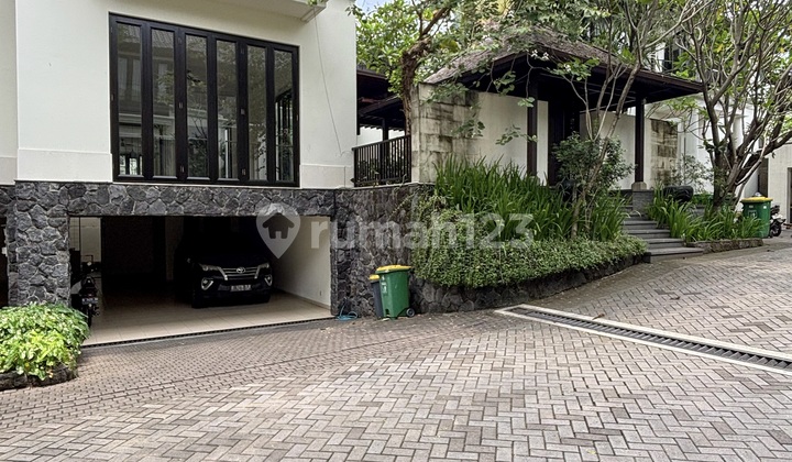 For Rent/Lease Beautiful Tropical House with Swimming Pool in a Serene Housing Complex, Wide Access Road, Semi-Furnished in Pejaten, South Jakarta.