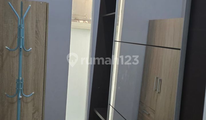 Affordable 2-Story Minimalist Semi-Furnished Ready-to-Occupy House Near Gwalk in Royal Park Citraland Utama West Surabaya 2