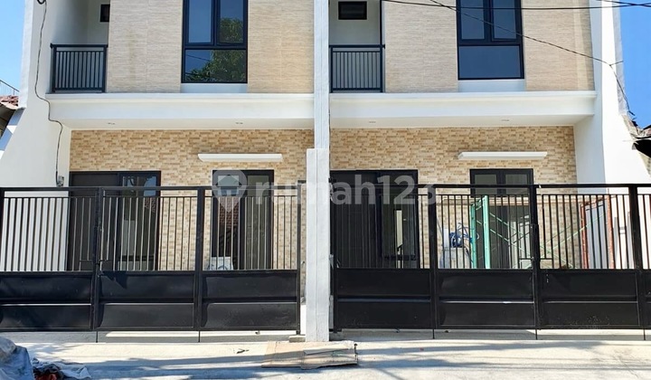 Nirwana Executive Selling New Minimalist Row Houses on a Wide Road